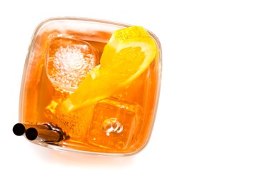 top of view of glass of spritz aperitif aperol cocktail with orange slices and ice cubes
