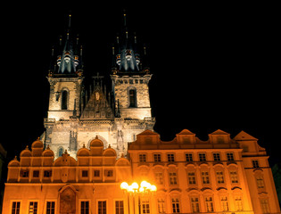 The Tyn Church in the light of lanterns evening. Located on the Old Town Square in Prague, the main parish church district Nove Mesto.
