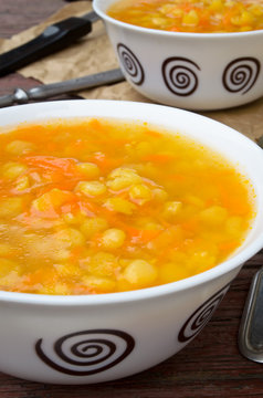 Yellow pea soup with vegetables and oil
