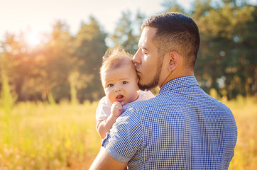 Father and baby in autumn outdoors