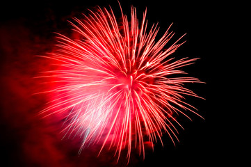Red flash of fireworks and red smoke