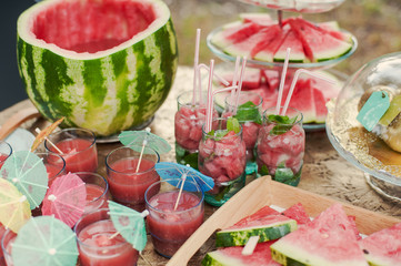 Fresh watermelon juice in the glass on wooden table