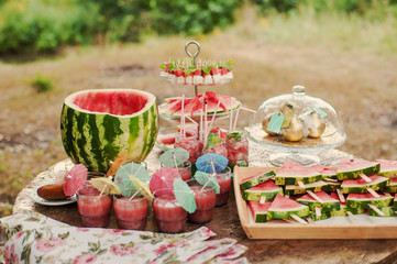 Fresh slices of watermelon on the wooden table