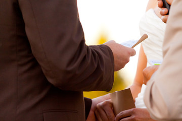 Groom Reading Vows to Bride