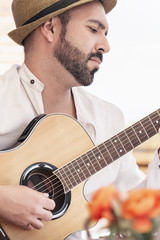 man plays the guitar on the street. retro style.