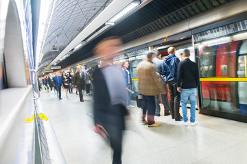 Travelers movement in tube train station, London..