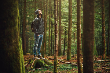 Hooded man posing in the forest - Powered by Adobe