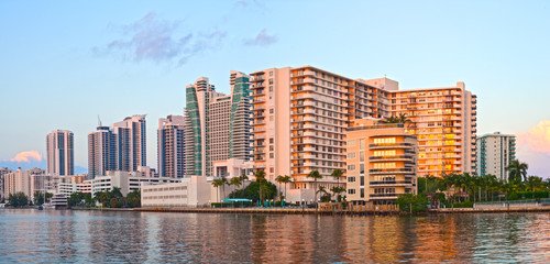 Hollywood Florida, buildings at sunset reflected in the water - 93736633