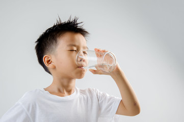 Boy drink water from glass