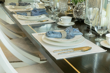 elegant table set in classic style dining room interior