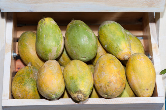 papaya in wooden box