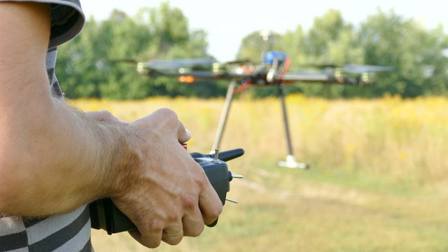 
Pilot's hands with  radio transmitter,  operate of drone.4K 3840x2160
