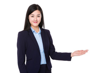 Young businesswoman with open hand palm