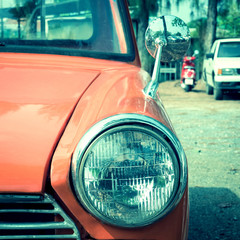 close-up headlight of colourful classic car