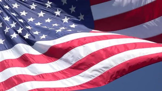 United States USA flag close blue sky background 4K