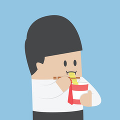 Businessman eating instant noodle cups
