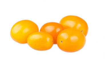 Yellow cherry tomatoes on white background