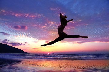 Jumping Girl with Sunrise Background
