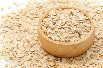 Closeup oats in bowl, on oats background.