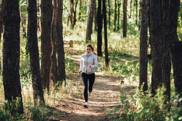  Runner woman jogging in autumn park