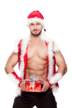 Image of sexy man wearing santa claus costume, isolated on white