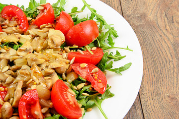 Salad with Tomatoes, Mushrooms, Arugula and Sunflower Seeds
