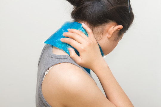 woman putting gel pack on swollen neck