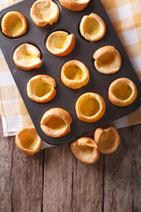 Yorkshire puddings in baking dish on the table. vertical top view

