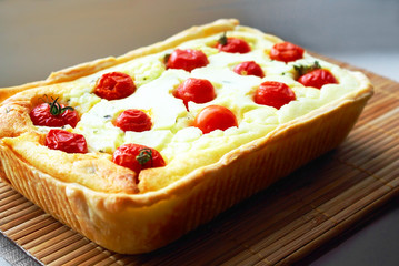 Tasty Baked Pie with Ricotta and Cherry Tomatoes.