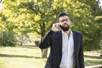 smiling hipster at phone