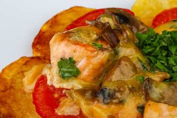 Roasted salmon with potato and tomato