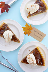 Traditional Thanksgiving Pecan Pie on Pale Blue Wood.