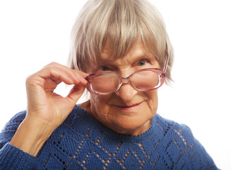 old senior lady looking through her eyeglasses