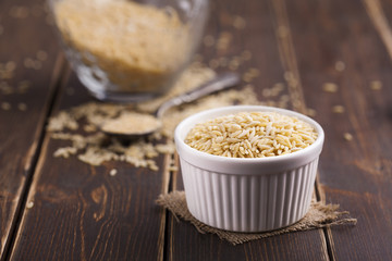 noodle with white plate on a wood background