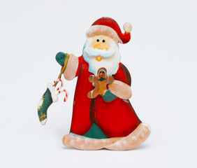 vintage Santa Claus metal figure christmas decoration on white background
