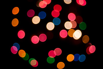 Decorative multi color christmas lights on a black background