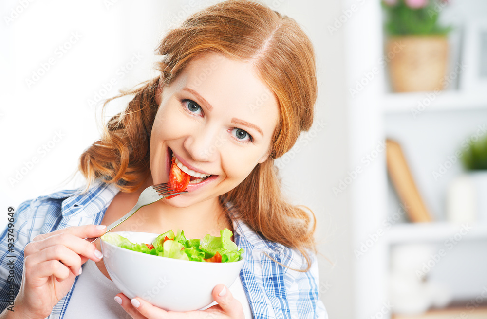 Wall mural woman eating healthy vegetarian food vegetable salad