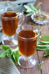 Sage tea on wooden background