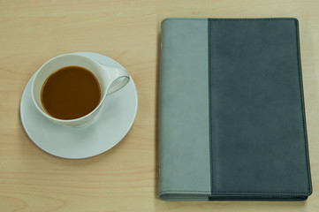 Obraz na płótnie Canvas a cup of coffee and a book
