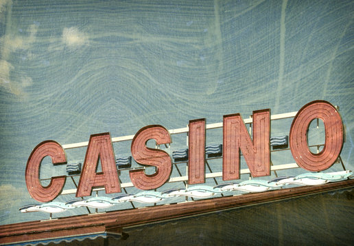 aged and worn vintage photo of red casino sign