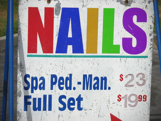 Fototapeta premium colorful nail salon sign with spa prices
