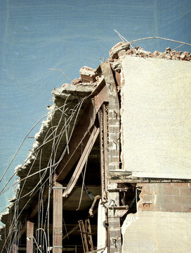 Aged And Worn Vintage Photo Of Destroyed Building After Disaster