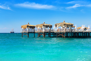 Pier and tropical sea with turquoise water