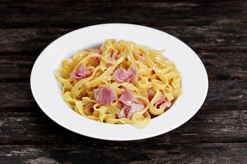 Pasta carbonara with tagliatelle spaghetti with bacon, egg york and Parmesan Cheese.