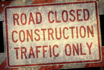 aged and worn vintage photo of road closed sign