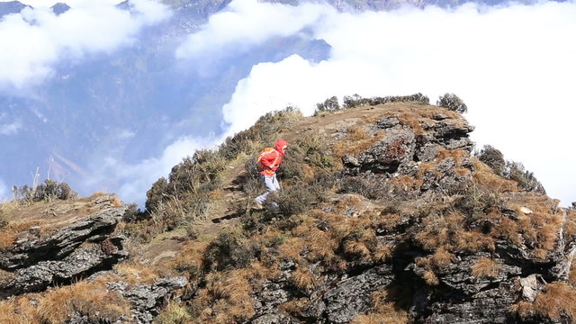 hiking woman enjoy the view on beautiful mountain peak