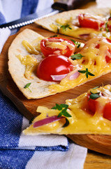 Flat tortilla with cheese and vegetables