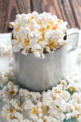 Salty white popcorn in old cup