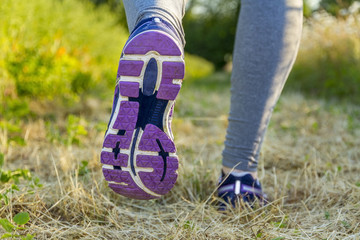 Woman running in a field