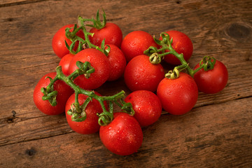 fresh tomato on wooden kitchen table